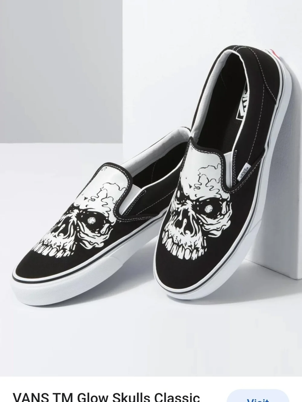 Vans Classic Kids Black & White Slip-On Sneakers with Skull Graphic